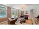 Bright living room featuring an outdoor patio, hardwood floors, and stylish furniture at 1774 Cherokee Dr, Sarasota, FL 34239