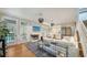 Bright living room with hardwood floors, modern fireplace, and French doors to outdoor porch at 1774 Cherokee Dr, Sarasota, FL 34239