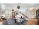 Bright and modern living room with stylish decor, hardwood floors, and comfortable seating at 1774 Cherokee Dr, Sarasota, FL 34239