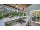 Modern outdoor kitchen featuring marble countertops, stainless steel appliances, and a view of the pool and gazebo at 1774 Cherokee Dr, Sarasota, FL 34239