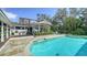 Stunning pool with an outdoor kitchen and entertainment area at 1774 Cherokee Dr, Sarasota, FL 34239