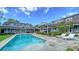 Beautiful backyard with a refreshing pool, lounging chairs, and lush greenery at 1774 Cherokee Dr, Sarasota, FL 34239