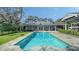 Inviting pool and backyard with a charming two-story home at 1774 Cherokee Dr, Sarasota, FL 34239