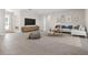 Living room features an inviting layout with tile floors and contemporary furnishings at 18100 Poston Ave, Port Charlotte, FL 33948