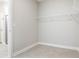 Empty walk-in closet featuring wire shelving and tile flooring at 18100 Poston Ave, Port Charlotte, FL 33948