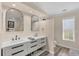 Modern bathroom with double sinks, sleek countertops, and contemporary design, offering a luxurious and functional space at 2005 21St W St, Palmetto, FL 34221