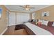 Charming bedroom with ample closet space, a cozy sitting area, and warm wood floors, offering comfort and functionality at 2005 21St W St, Palmetto, FL 34221