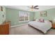 Cozy bedroom with natural light features a ceiling fan, and a large window at 2005 21St W St, Palmetto, FL 34221