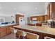 Spacious open concept kitchen with an island, bar seating, and granite countertops at 2005 21St W St, Palmetto, FL 34221