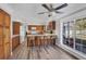 Open concept kitchen featuring wood cabinets, granite countertops, an island, and breakfast bar seating at 2005 21St W St, Palmetto, FL 34221