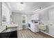 Functional laundry room with modern washer and dryer, complemented by ample counter space at 2005 21St W St, Palmetto, FL 34221