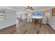 Open concept living room with dining area, recessed lighting, and wood floors at 2005 21St W St, Palmetto, FL 34221