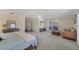 Expansive main bedroom suite with sitting area, large window views, and neutral decor, offering a serene and private atmosphere at 2005 21St W St, Palmetto, FL 34221