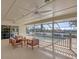Relaxing screened-in patio has comfortable seating and views of the pool and surrounding landscape at 2005 21St W St, Palmetto, FL 34221