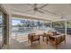 Covered patio includes cozy seating areas and views of the pool and fenced-in yard at 2005 21St W St, Palmetto, FL 34221