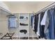 Organized walk-in closet with ample storage, shelves, and hanging space, providing a functional and tidy wardrobe solution at 2005 21St W St, Palmetto, FL 34221
