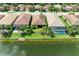 A beautiful aerial shot of waterfront homes featuring mature landscaping and private docks at 204 Maraviya Blvd, Nokomis, FL 34275