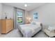 Calming bedroom with a large window, soft carpet, and neutral colors throughout at 204 Maraviya Blvd, Nokomis, FL 34275