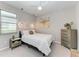 Cozy bedroom featuring a ceiling fan, soft lighting, and elegant decor at 204 Maraviya Blvd, Nokomis, FL 34275