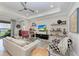 Spacious living room featuring contemporary furnishings, neutral decor, and outdoor views at 204 Maraviya Blvd, Nokomis, FL 34275