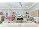 Bright living area with modern decor, tray ceiling, stylish furniture, and ample natural light at 204 Maraviya Blvd, Nokomis, FL 34275