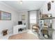 Bright office space with a modern white desk, comfortable chair, and a stylish bookshelf at 204 Maraviya Blvd, Nokomis, FL 34275