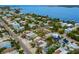 This aerial view captures a charming residential area close to the beautiful waters at 2213 Avenue C, Bradenton Beach, FL 34217
