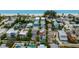An aerial view shows the beautiful community near a beach with blue water at 2213 Avenue C, Bradenton Beach, FL 34217
