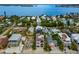 An aerial shot shows a waterside community close to a bay at 2213 Avenue C, Bradenton Beach, FL 34217