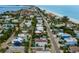 An aerial view of a vibrant beach community with colorful homes and easy access to the ocean at 2213 Avenue C, Bradenton Beach, FL 34217