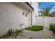 Backyard featuring a small patch of grass and gate at 2213 Avenue C, Bradenton Beach, FL 34217