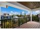 This beautiful balcony features a wood ceiling and a black metal railing at 2213 Avenue C, Bradenton Beach, FL 34217