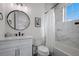 Elegant bathroom featuring a marble tiled shower, a sleek vanity, and modern fixtures at 2213 Avenue C, Bradenton Beach, FL 34217
