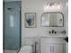 Modern bathroom features a glass shower, stylish fixtures, and elegant design at 2213 Avenue C, Bradenton Beach, FL 34217