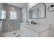 Stylish bathroom featuring a glass shower and vanity with sleek fixtures at 2213 Avenue C, Bradenton Beach, FL 34217