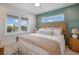 Inviting bedroom featuring two windows and a woven headboard at 2213 Avenue C, Bradenton Beach, FL 34217