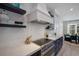 Modern kitchen features stainless steel appliances, stone countertops, and stylish decor at 2213 Avenue C, Bradenton Beach, FL 34217