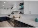 Modern kitchen features stainless steel appliances, stone countertops, and stylish decor at 2213 Avenue C, Bradenton Beach, FL 34217