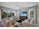 Living room with comfortable seating, coastal decor, and scenic outdoor views at 2213 Avenue C, Bradenton Beach, FL 34217