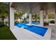 Modern pool and patio with lounge area, perfect for outdoor relaxation and entertaining at 2213 Avenue C, Bradenton Beach, FL 34217