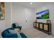 Comfortable sitting area with modern decor, accent chairs, and a TV, perfect for relaxing at 2213 Avenue C, Bradenton Beach, FL 34217