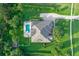 An aerial view of a beautiful property with a well-maintained yard and a sparkling blue pool at 22343 Panther Loop, Bradenton, FL 34202