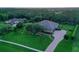 Aerial shot of home showing large lot, mature trees and a paved driveway at 22343 Panther Loop, Bradenton, FL 34202