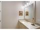 Bathroom featuring neutral color scheme, a marble counter and a decorative mirror at 22343 Panther Loop, Bradenton, FL 34202