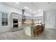 Bright kitchen featuring a large island, stainless steel appliances, and seamless integration with the dining area at 22343 Panther Loop, Bradenton, FL 34202