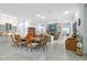 Open-concept living area with dining table, fireplace, and natural light at 22343 Panther Loop, Bradenton, FL 34202