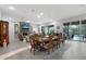 Open-concept living and dining area filled with natural light and views of the backyard and pool at 22343 Panther Loop, Bradenton, FL 34202