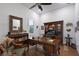 Sophisticated home office with custom built-ins, elegant wood desk, and a serene ambiance at 22343 Panther Loop, Bradenton, FL 34202