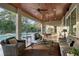 Inviting outdoor patio with seating, dining, and lounge areas and a view of the pool at 22343 Panther Loop, Bradenton, FL 34202