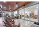 Large patio with tile floor, wood ceiling, and multiple seating areas at 22343 Panther Loop, Bradenton, FL 34202